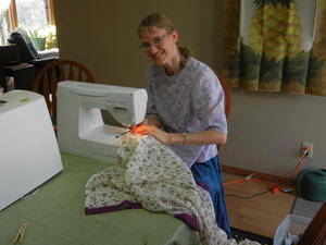 Kristina took advantage of some free time to start sewing curtains. This piece of material was intended to be an Indian Sari, but was too short, so we put it to good use.