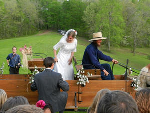 Climbing into the wagon.