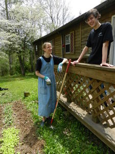 Kristina taking a break from gardening to chat with Lucas.