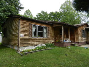 Daniel spent two days bleaching the siding to get rid of the mildew. Here it is, all ready for painting!