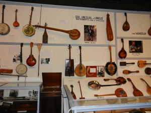 Here's some of the more unusual instruments we saw there. Check out the toilet seat banjo and the cookie tin banjo and the gourd fiddle!