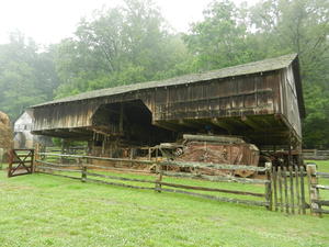 The barn has a VERY large overhang on all sides.