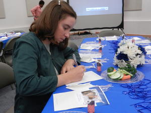 Kim doodling on the "Wedding Doodle Pad" that everyone was given.