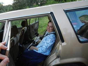 Kim watching the view from her seat in the car.