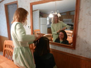 Kristina fixing Kim's hair just before the wedding.