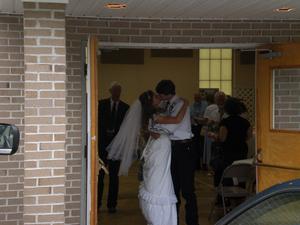 Stealing a kiss before coming out the door where everyone was waiting.