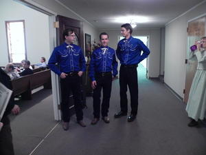 Groomsmen ready to usher more guests (while Kristina snatches a quick drink of water).