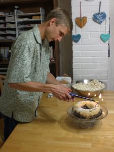 We celebrated Daniel's Dad's birthday a couple week's late, and surprised him with a cake! Here's Daniel lighting the candles.