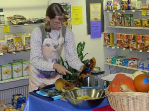 Kristina teaching how to cook Squash at a cooking class.