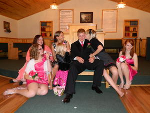 Sister kissing the groom!