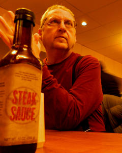 Saturday night, we headed out into town for the ice festival and met Timothy at a buffet for some food. Dad's here in this picture, deep in thought.