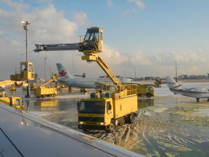 Kristina had a perfect view of the wing and the machines used to de-ice the plane!