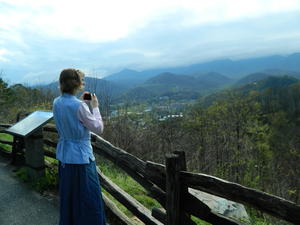 When we checked out of our cabin, on Sunday morning, we decided to have some fun before heading home. Here, Kristina is photographing the mountains above Gatlinburg.