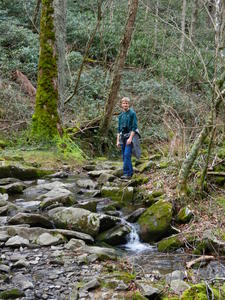 Daniel crossing a spring along the trail.