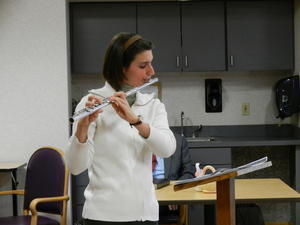 Amy playing her flute for special music at the nursing home.