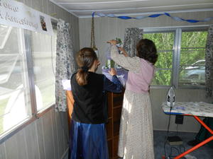 We put a welcome banner in their living room, along with streamers. We also decorated their bookcase.