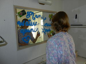 Kristina decorated their bathroom mirror with a Bible Verse: "Many waters cannot quench love." (Song of Solomon 8:7)