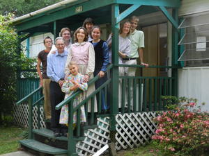 We did other things too--hung pictures on their walls, filled their pantry with goodies, and then posed on the porch for a group photo before we all scurried home. :)