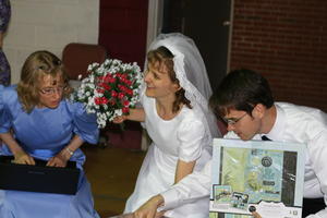 Meanwhile, Kristina was inside helping David and Kristina A open and record their gifts.