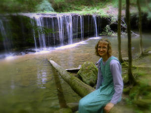 Kristina resting on a log.