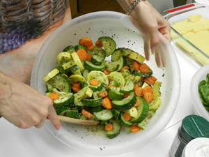 Mmmm! Yummy! Vegetable Polenta Casserole. The steamed vegetables are in the bowl, and you can see the polenta slices in the bottom of the casserole dish.