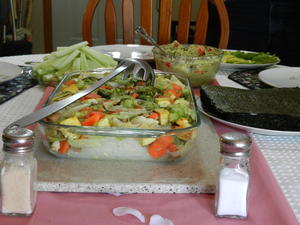 Asian menu--Kristina's favorite! Sushi rice, seaweed, and avocado and cucumber--everyone got to assemble their own sushi; the large dish is asian noodles and veggies. It was a feast!