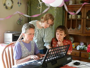 After everyone was done, the three girls put their heads together to try and piece Mom's puzzle into something musical. It was a song that none of them knew, so it was a real challenge and took some serious teamwork to figure it out!