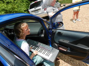 Kristina played the keyboard and led the singing at the creek's edge.