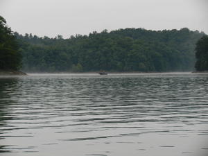 Fishermen out in the mist.