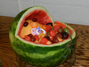 Baby in a watermelon cradle.