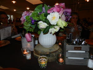 The bouquet of silk flowers on their table.