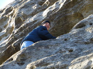 Isaac climbing up the arch.
