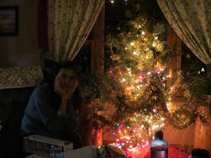 LydiaLaJewel sitting next to the Christmas tree. 