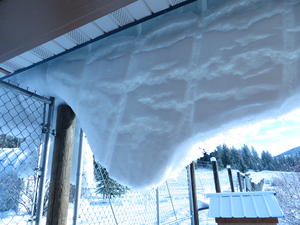 Snow hanging off the roof at Kristina's parents' house.
