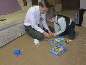 Daniel enjoyed playing with legos with friends at the Christmas party.