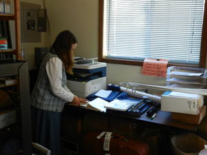 Kim printing bulletins.