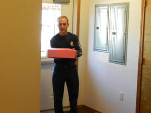 Claude bringing in the wedding cake.