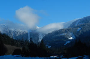 As they got closer to the pass, little puffs of clouds began to form on the mountain crests.