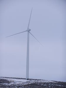 Rolling hills and windmills dotted the snowy landscape.