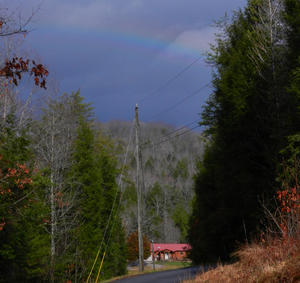 Home again! Kristina had an unexpected treat of seeing a rainbow over our neighbor's house!