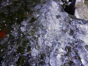 More ice on the boulders behind the falls. Looked like marbles!